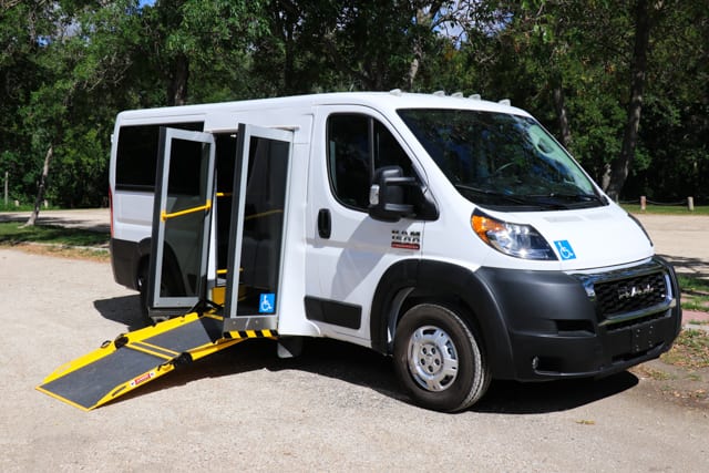 Accessible promaster mobility van with ramp deployed. Wheelchair accessible van.