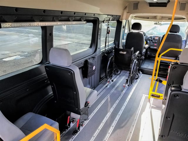 AMF Smartfloor system shown in Ram Promaster 3500 wheelchair mobility van with removeable 17 inch seats on wheels, wheelchair restraint securement system for mobility transportation