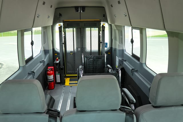 rear hydraulic lift inside Ford Transit wheelchair van