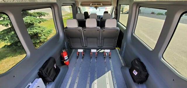 MoveMobility Ford Transit mobility van with six removeable AMF Bruns seats, AutoFloor flexible seating system, large windows, rear heat and air conditioning, two wheelchair positions, braunbility rear entry hydraulic lift