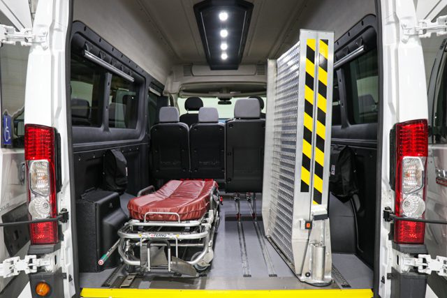 ram promaster with bi fold swinging wheelchair ramp and stretcher secured to floor