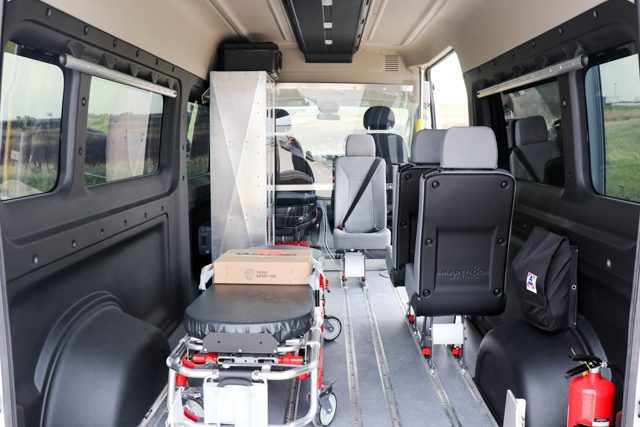 patient transport van with ferno stretcher, attendant seats, aluminum medical storage cabinet