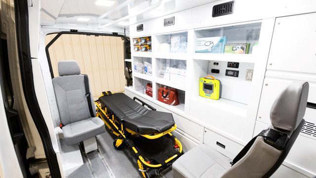 mobile medical van interior with aluminum cabinetry and stretcher at MoveMobility in Winnipeg