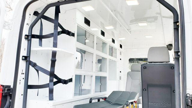 White aluminum ambulance-like medical cabinets inside a mobile medical van at MoveMobility
